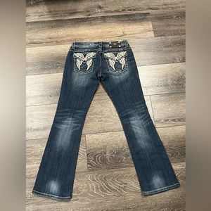 Boot cut, but a wider boot cut, miss me jean